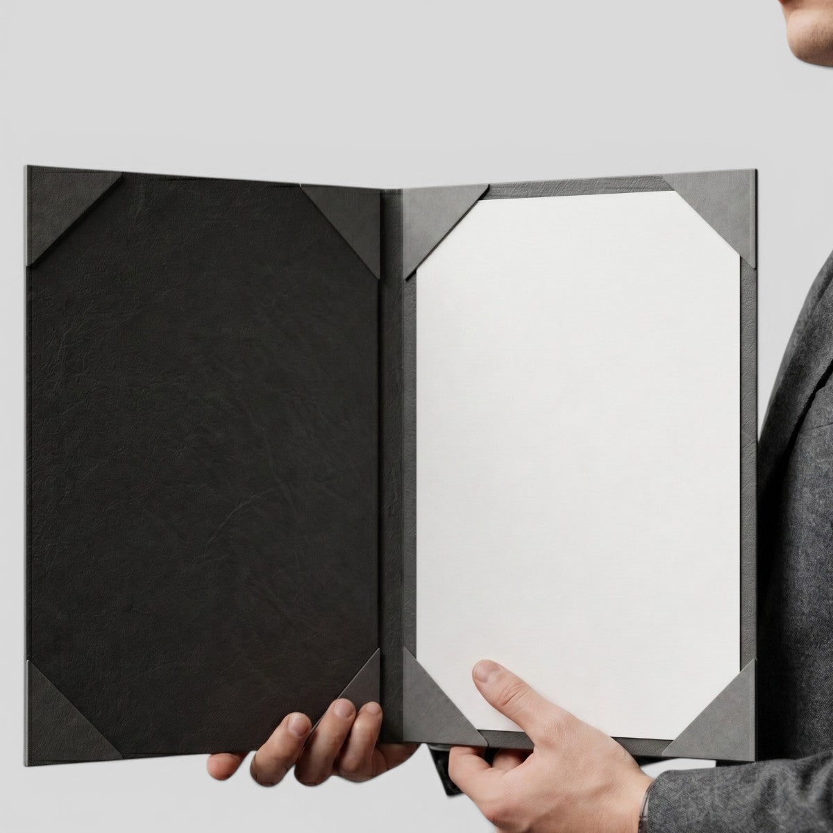 Stockka black textured certificate holder with corner pockets for document display. Made of laminated cardboard.
