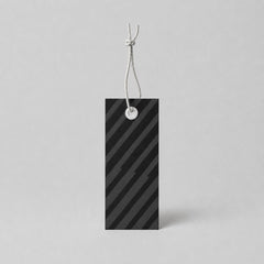 Stockka black rectangular hang tag with dark grey diagonal stripes and a white grommet, attached with a white string.