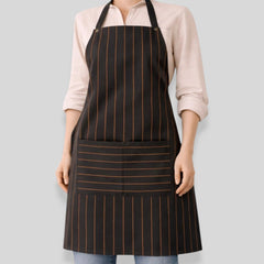 Stockka classic black and orange pinstripe full-length apron with adjustable neck strap and front pocket. Polyester-cotton blend.