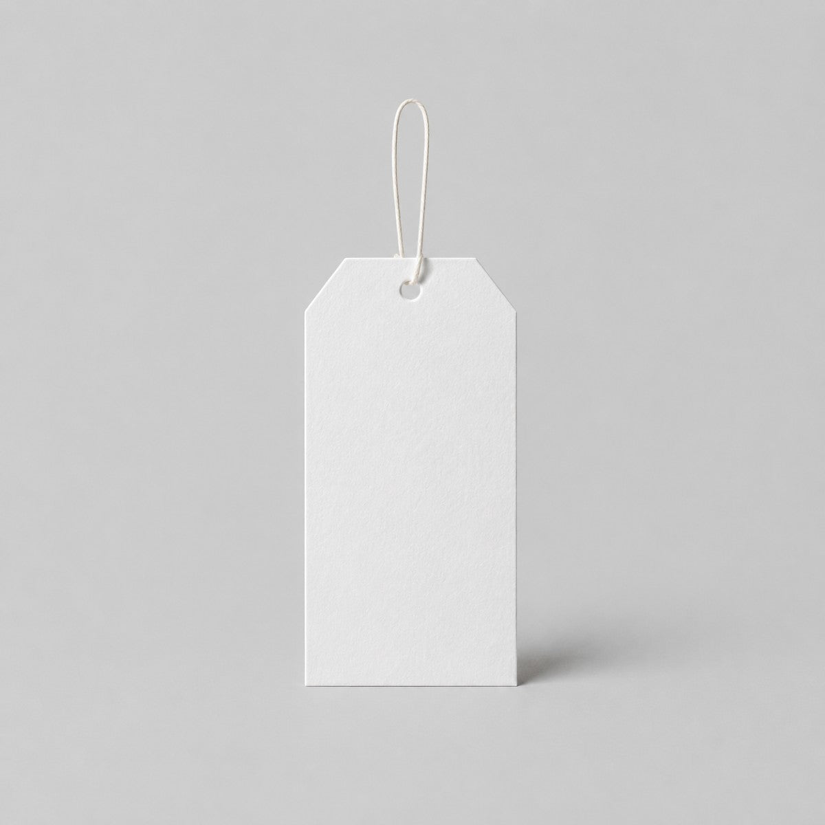 Stockka white blank paper bookmark tag with string loop, ideal for custom printing.