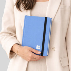Stockka soft blue notebook with elastic closure and internal ribbon bookmark, 80 lined pages, customizable design.