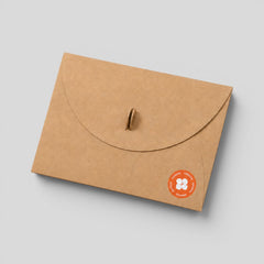 Stockka brown kraft paper envelope with a round flap and metal clip closure for luxury stationery and branding.
