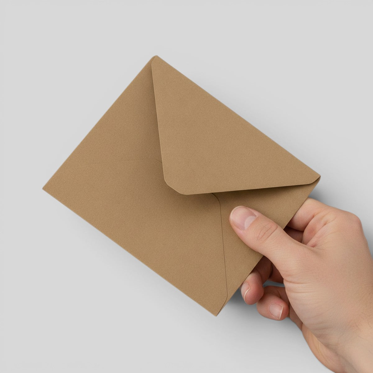 Stockka brown kraft paper envelope with classic triangular flap closure, perfect for natural, rustic, or eco-friendly branding.