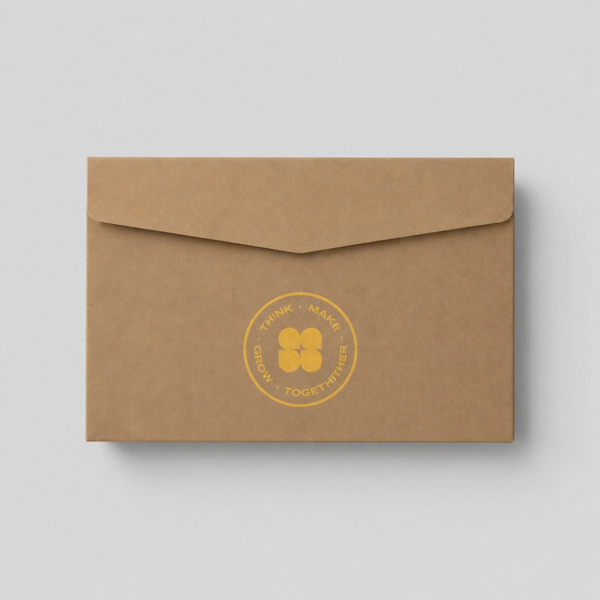 Stockka brown kraft paper envelope with a straight back flap and a yellow circular logo print for professional use.