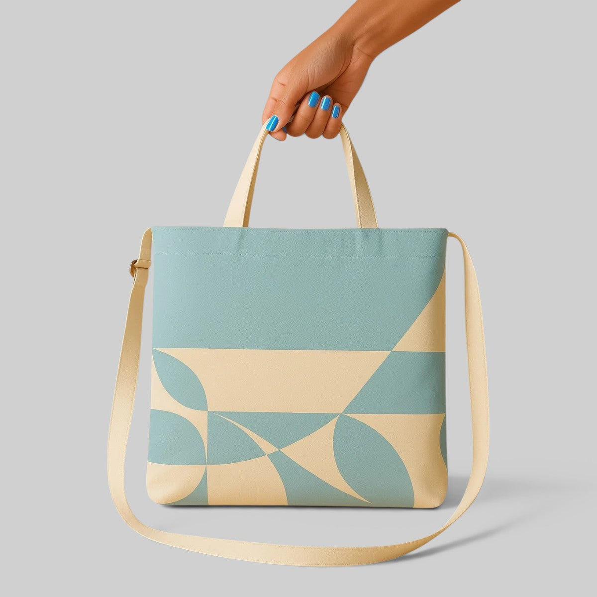 Stockka light blue and cream canvas messenger bag with geometric pattern and adjustable strap.