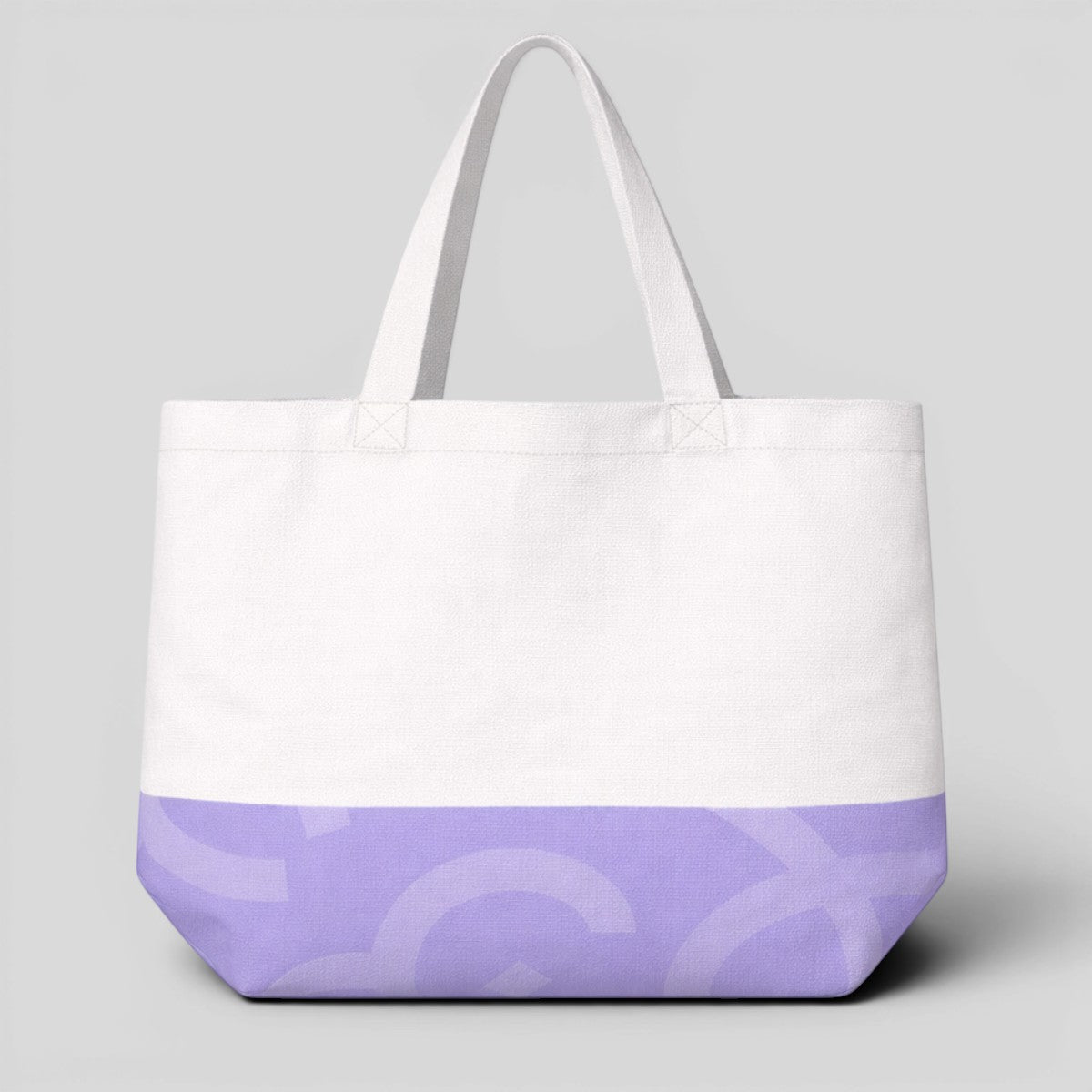 Stockka white canvas tote bag with a purple graphic print on the bottom and long handles for shoulder wear.