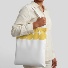 Stockka white canvas tote bag with yellow geometric pattern, 100% cotton, ideal for everyday use.