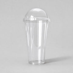 Stockka tall clear PET plastic cup with dome lid, ideal for smoothies and cold drinks.