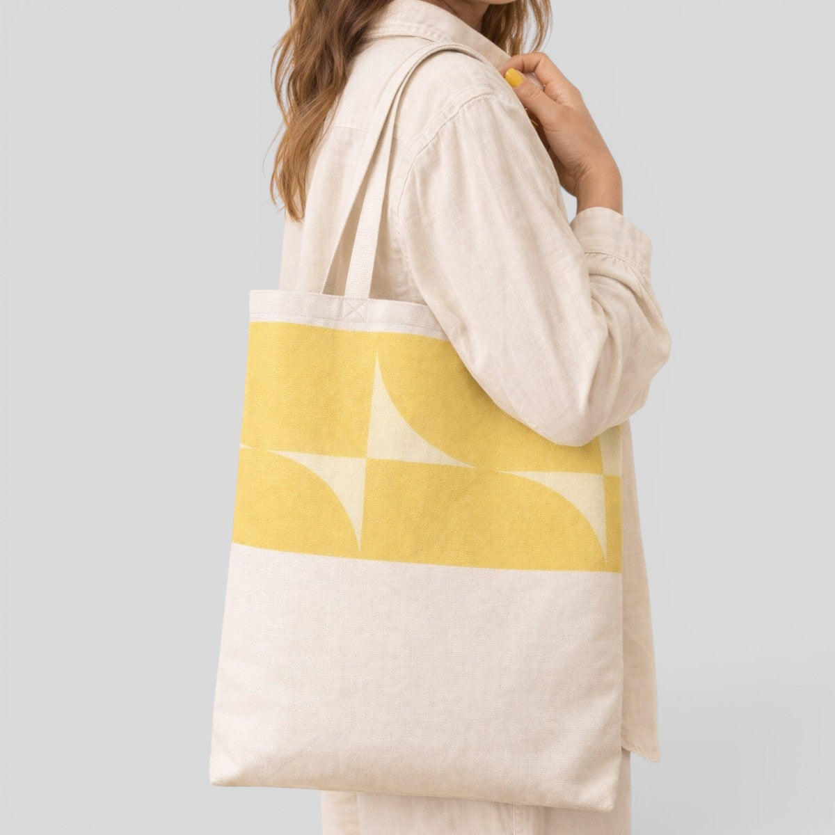 Stockka natural cotton canvas tote bag with a yellow geometric pattern, ideal for everyday use.