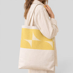 Stockka natural cotton canvas tote bag with a yellow geometric pattern, ideal for everyday use.
