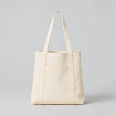 Stockka cream canvas tote bag with long shoulder straps and a wide front pocket. Ideal for everyday use or branding.