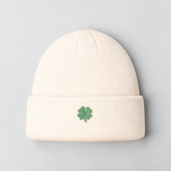 Stockka cream acrylic knit beanie with folded cuff and green clover embroidery. Unisex winter hat.