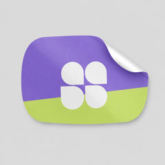 Stockka custom die-cut sticker with rounded corners, featuring a split design of purple and lime green with a white four-petal clover logo.