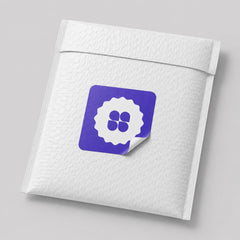 Stockka custom designed seal sticker with a white scalloped edge and a purple background featuring a white four-leaf clover design.