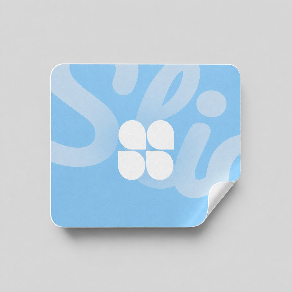Stockka custom square sticker with rounded corners, light blue with white abstract logo and text.