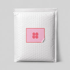 Stockka custom square sticker with pink stripes and a four-petal flower logo on a padded envelope.