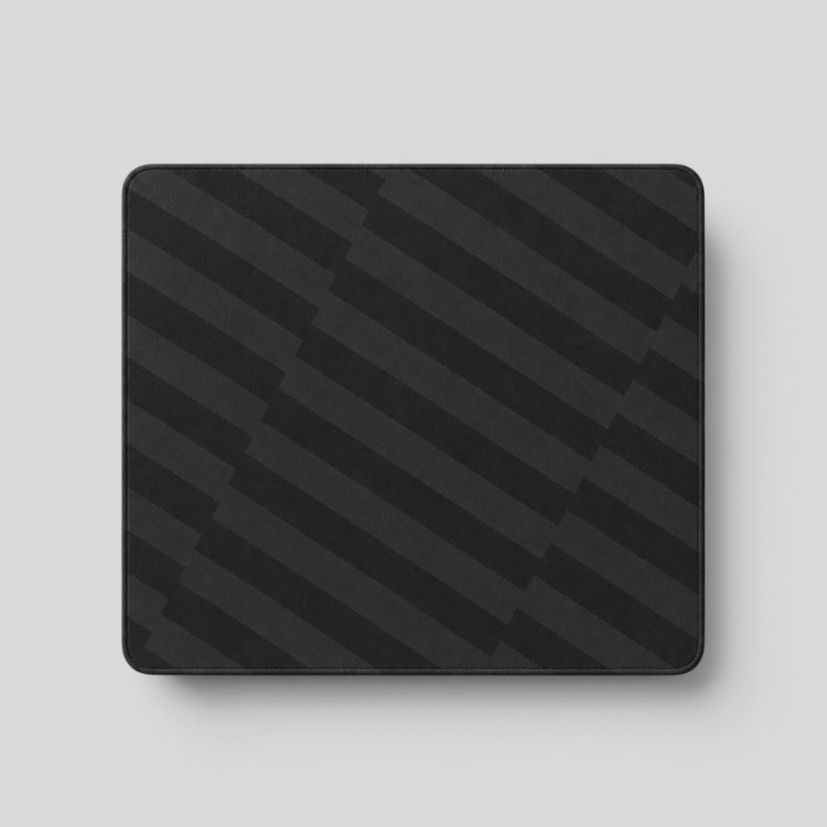 Stockka classic rectangular mousepad with a dark grey striped pattern, ideal for smooth mouse movement.
