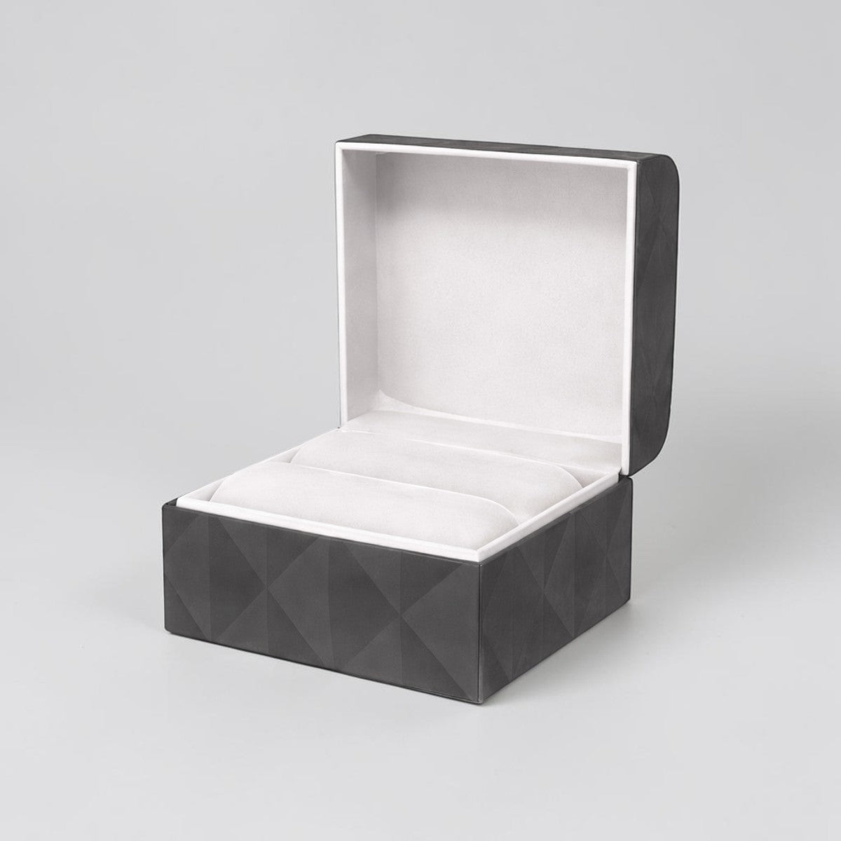 Stockka dark grey textured jewelry box with soft white interior, perfect for rings and accessories.