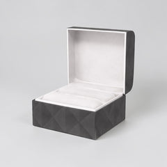 Stockka dark grey textured jewelry box with soft white interior, perfect for rings and accessories.