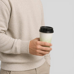Stockka double-walled paper cup with black lid, ideal for hot beverages like coffee or tea.