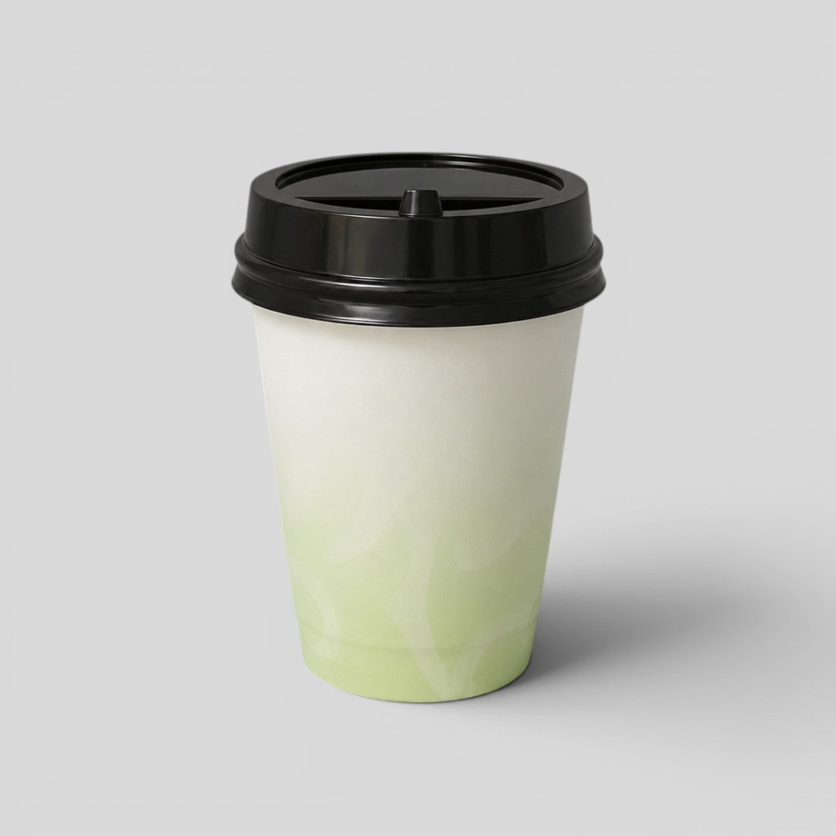 Stockka double-walled paper cup with black lid, white and green gradient design, 320ml capacity.