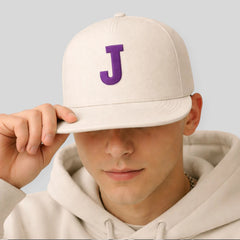 Stockka flat brim snapback cap in light grey cotton with a purple "J" initial. Adjustable strap.