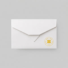 Stockka elegant white flat envelope with triangular flap, made of 300g matte coated paper for luxury branding.