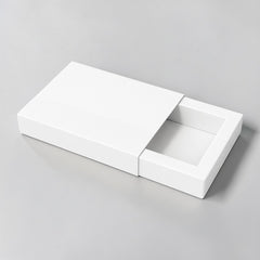 Stockka flat gift box with slide-out drawer, pink and cream, featuring a subtle flower logo. Ideal for thin items.