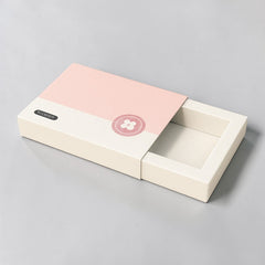 Stockka flat gift box with sliding opening, white with pink lid and floral logo. Ideal for thin items.