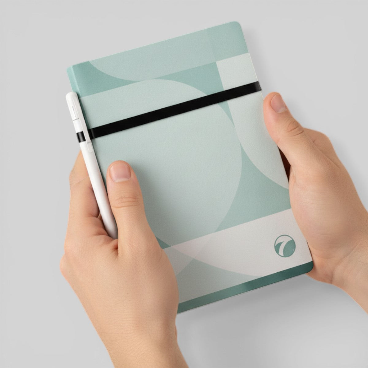 Stockka light blue and white geometric pattern notebook with pen holder and black elastic closure. Hardcover.
