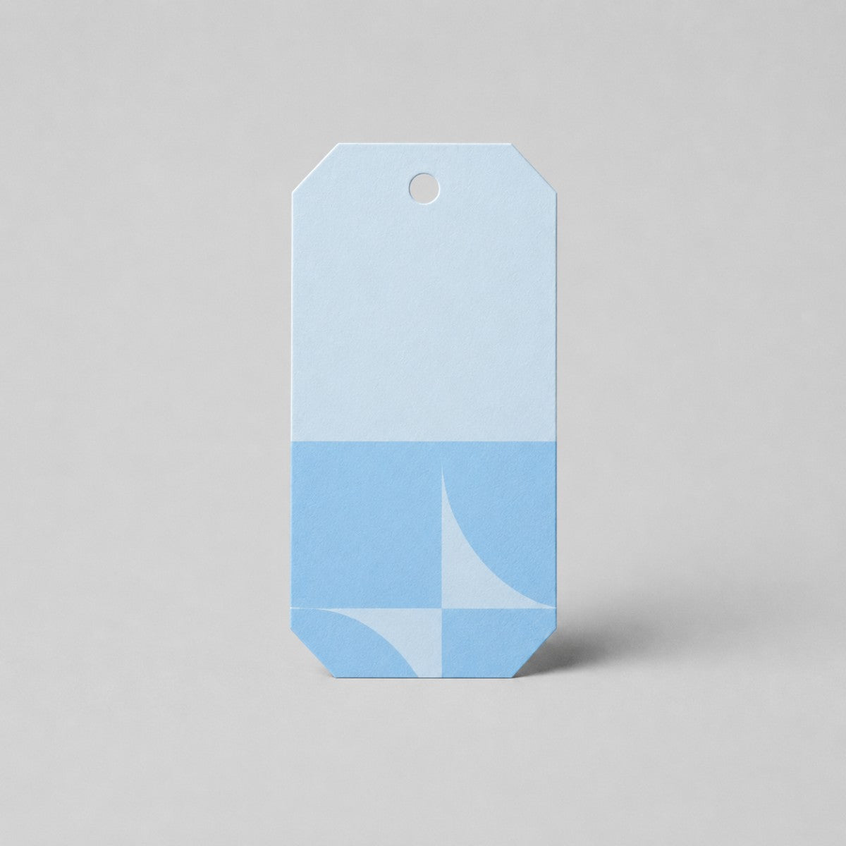 Stockka light blue and blue geometric pattern gift tag with hole punch