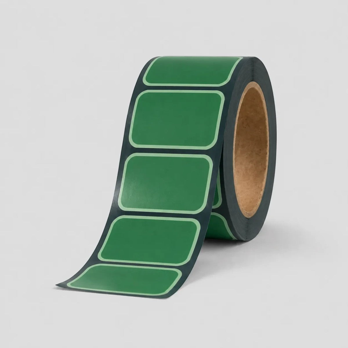 Stockka green rectangular stickers with rounded corners on a roll, ideal for product branding and packaging.