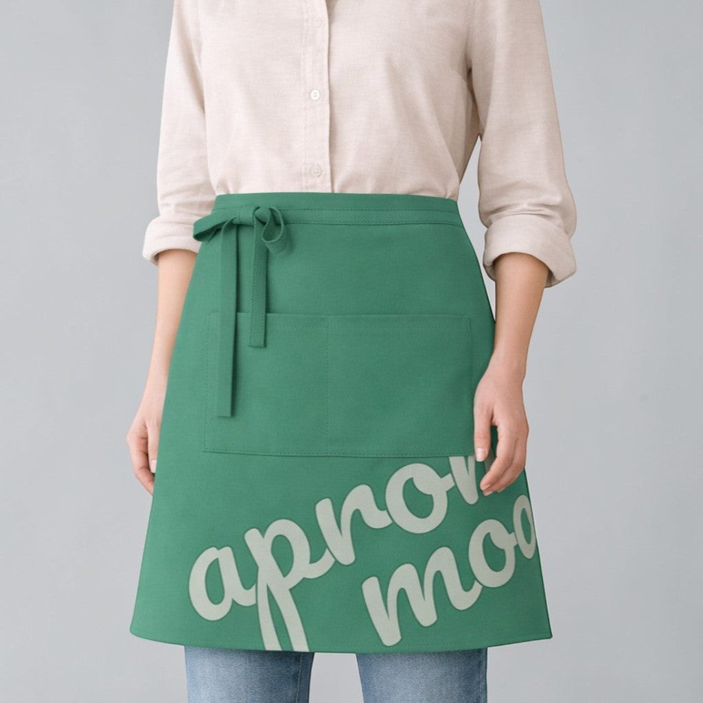 Stockka green polyester-cotton waist apron with front pocket and adjustable ties, ideal for cafes and restaurants.