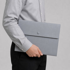 Stockka grey plastic envelope folder with button closure, ideal for documents.