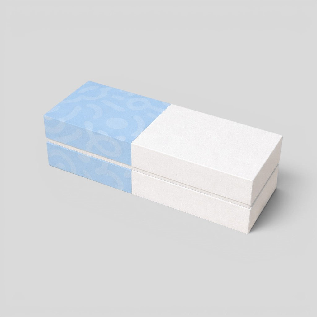 Stockka luxury gift box with magnetic closure, half light blue with pattern, half white. Ideal for jewelry.