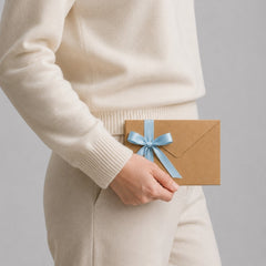 Stockka brown kraft envelope with light blue ribbon, ideal for gift cards and invitations.