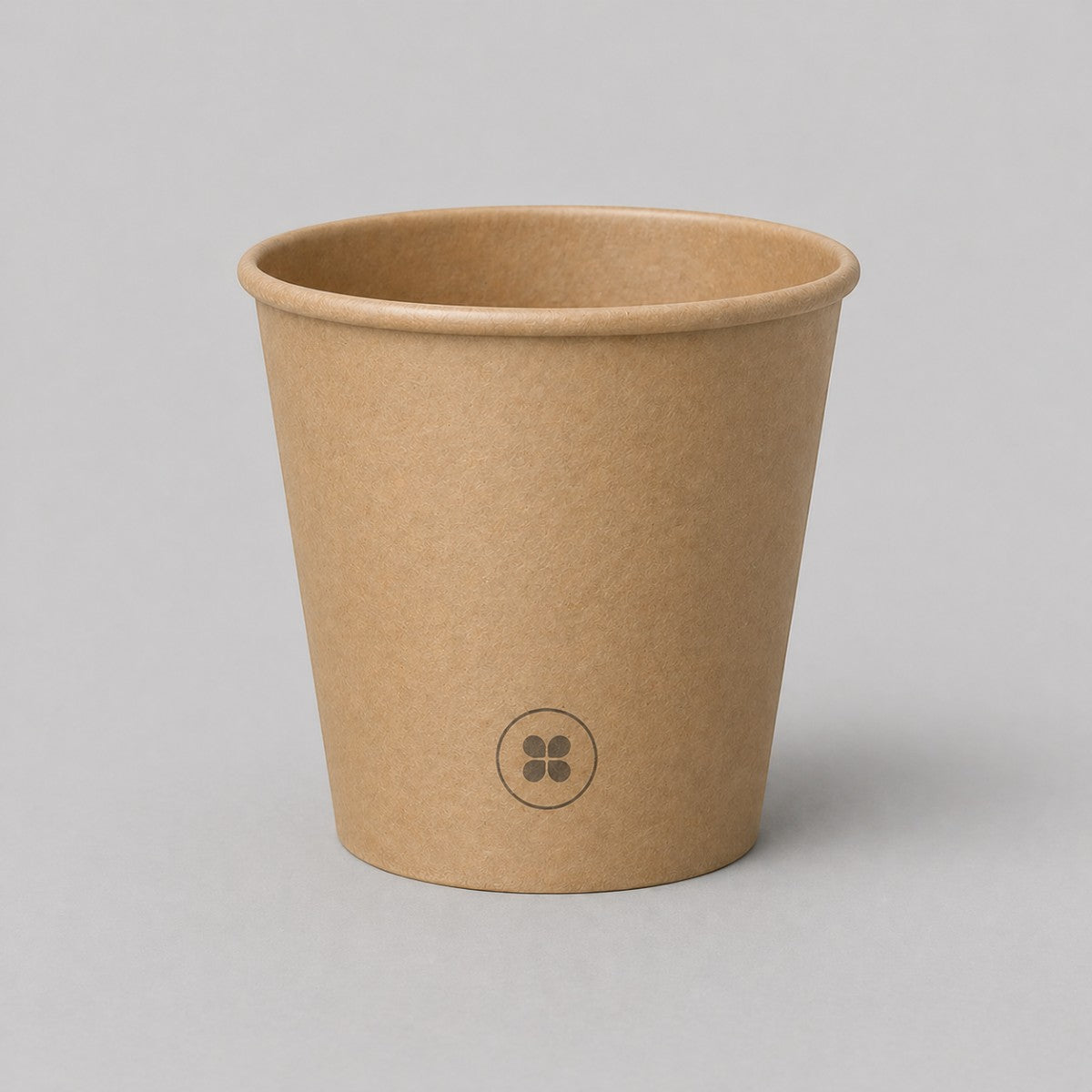 Stockka small minimalist brown kraft paper espresso cup with PE coating and a subtle circular logo.
