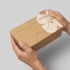 Stockka natural kraft cardboard gift box with twine tie and a cream floral design. Rectangular box, ideal for small items or lifestyle products.