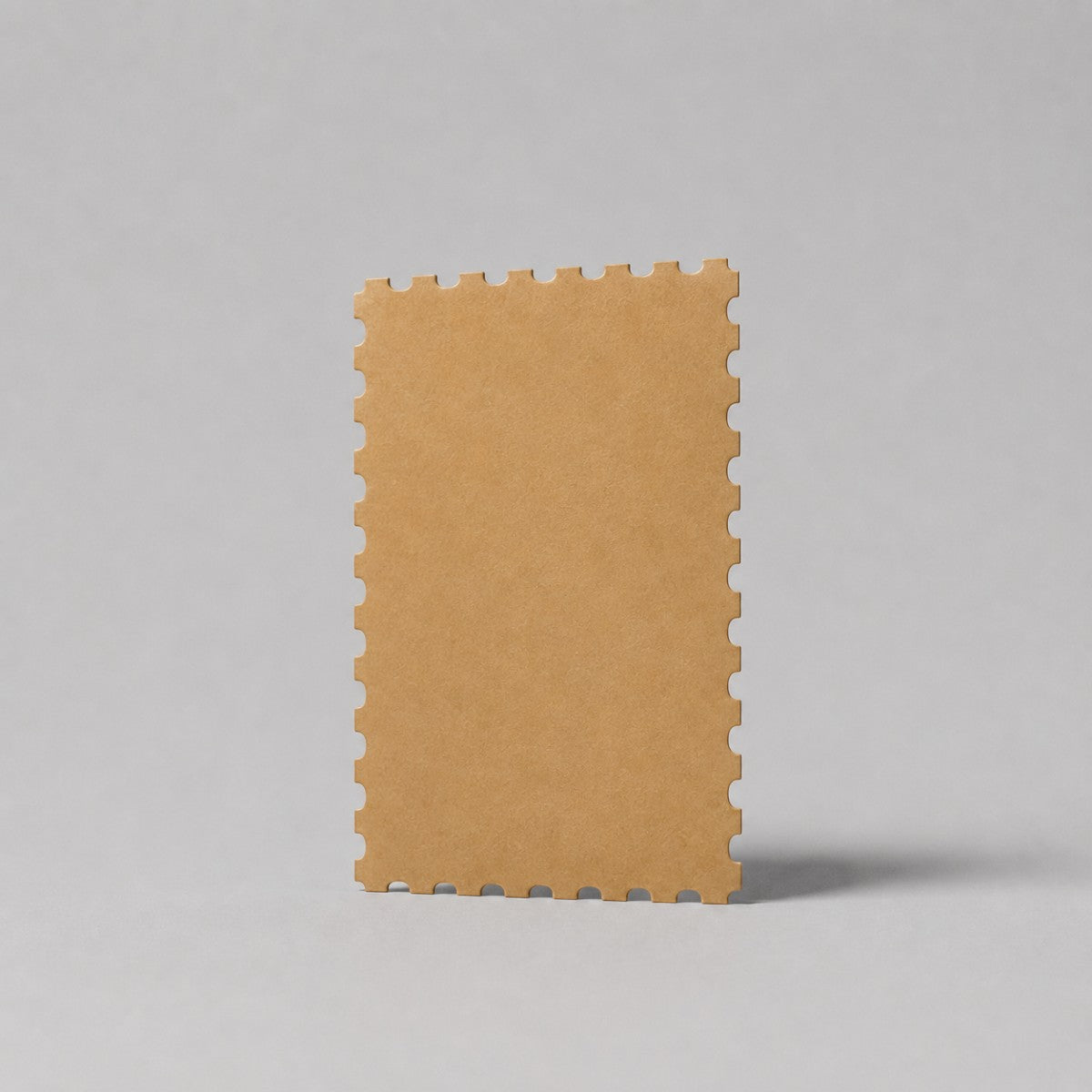 Stockka brown kraft paper greeting card with perforated edges, suitable for custom messages and branding.