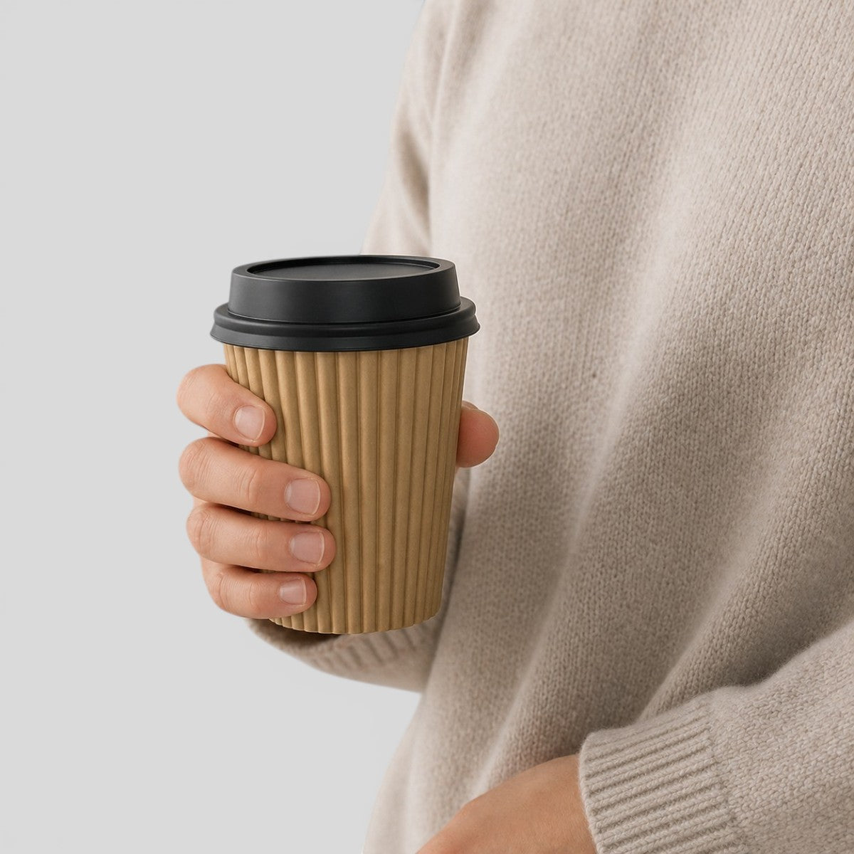 Stockka corrugated kraft paper cup with black lid, ideal for hot drinks like espresso, tea, or cappuccino.