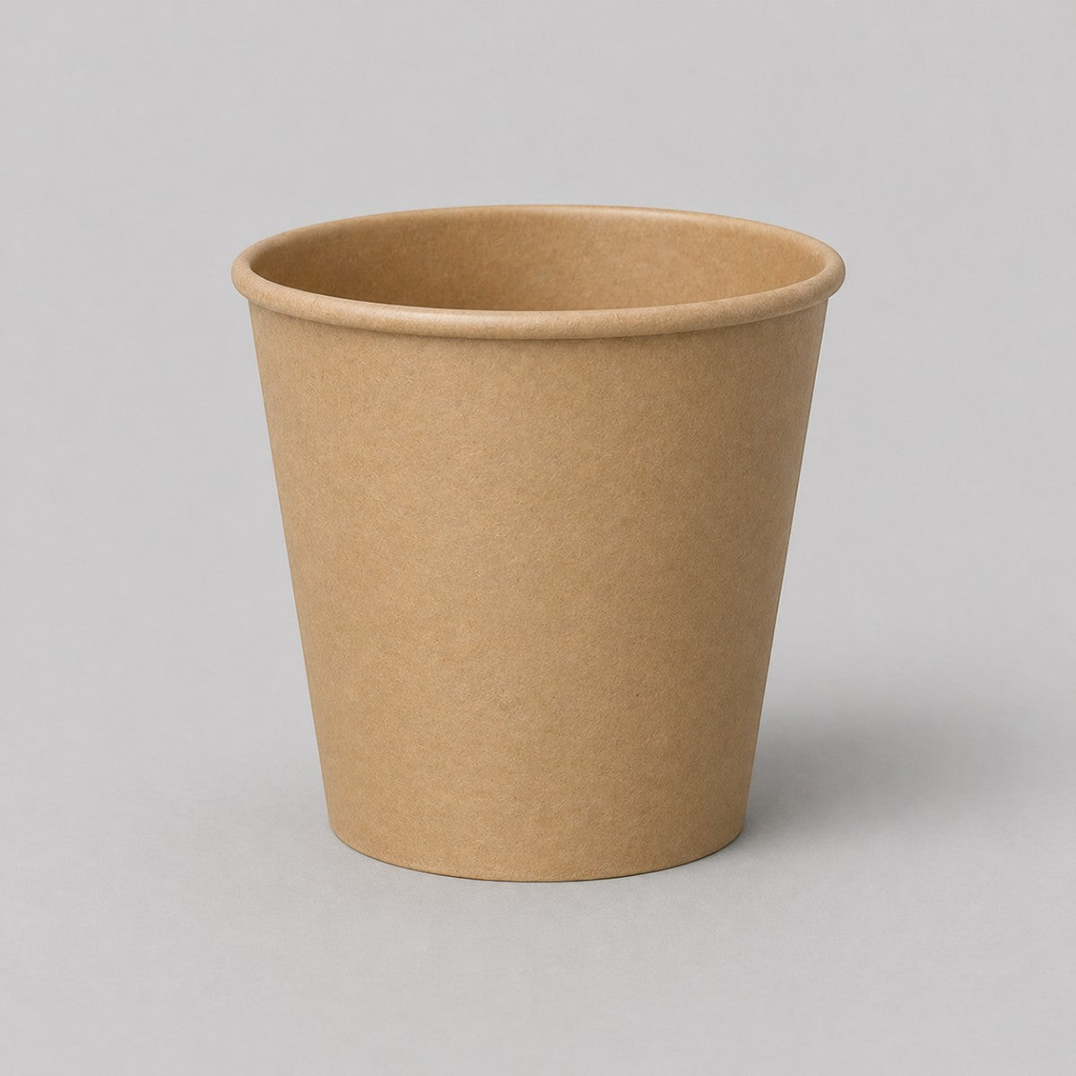 Stockka small minimalist brown kraft paper espresso cup with PE coating, ideal for short espressos or tastings.
