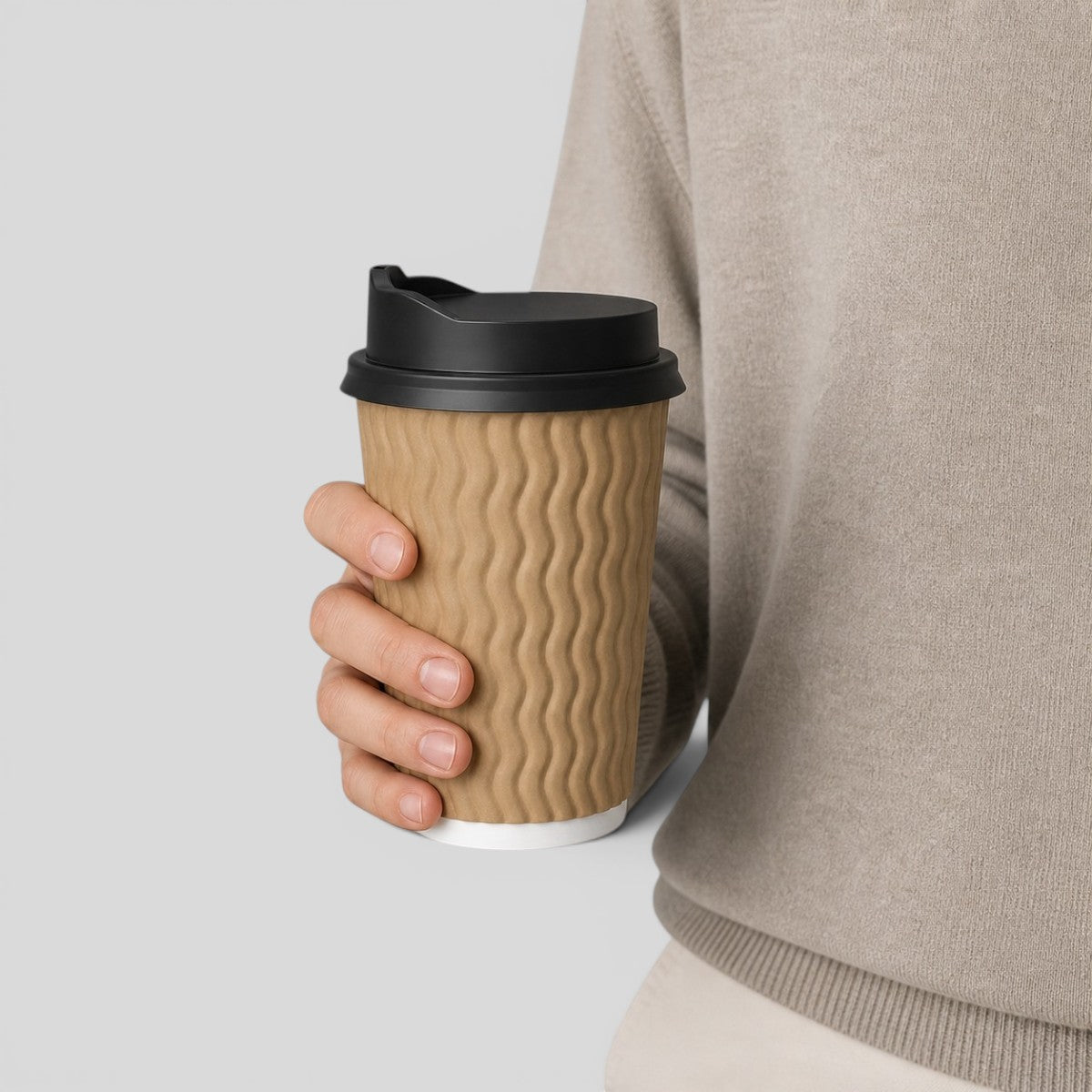 Stockka medium kraft ripple cup with black lid, perfect for coffee or tea. Insulated paper design.