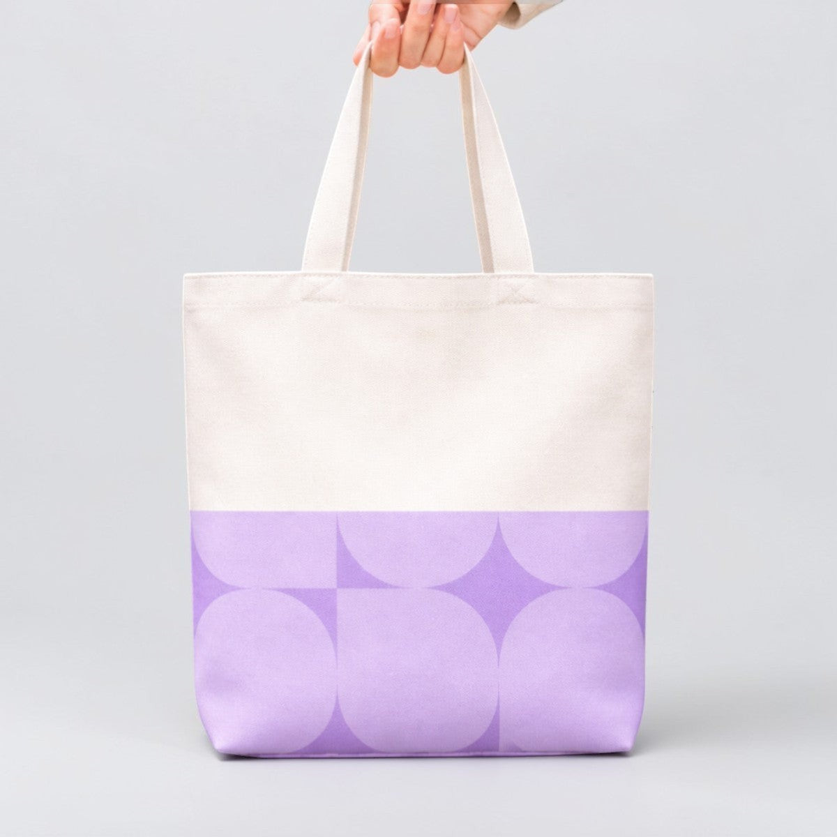 Stockka natural cotton canvas tote bag with a geometric lavender pattern on the bottom half. Ideal for everyday use or custom branding.