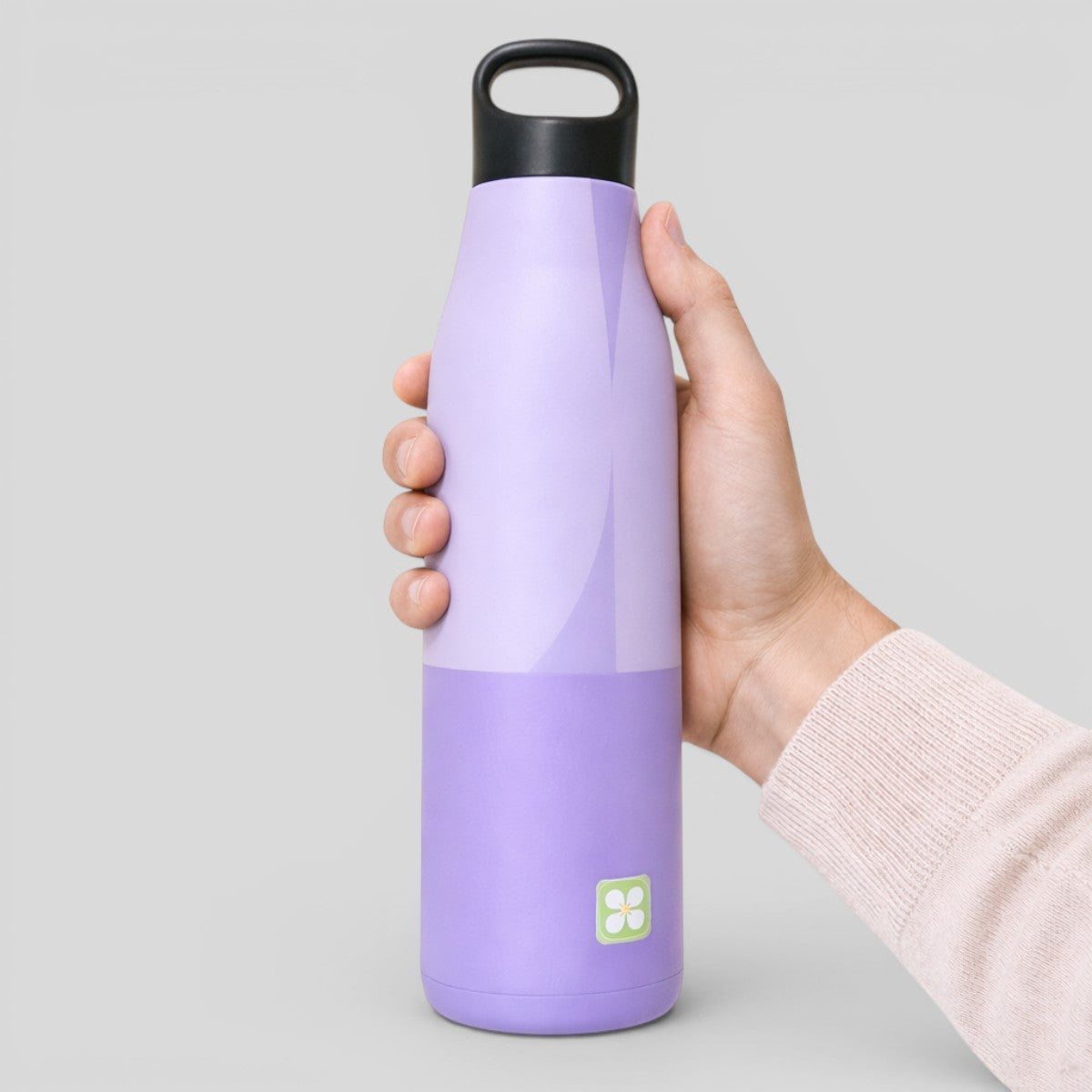 Stockka tall sport water bottle in lavender and purple, stainless steel with integrated handle and narrow spout.