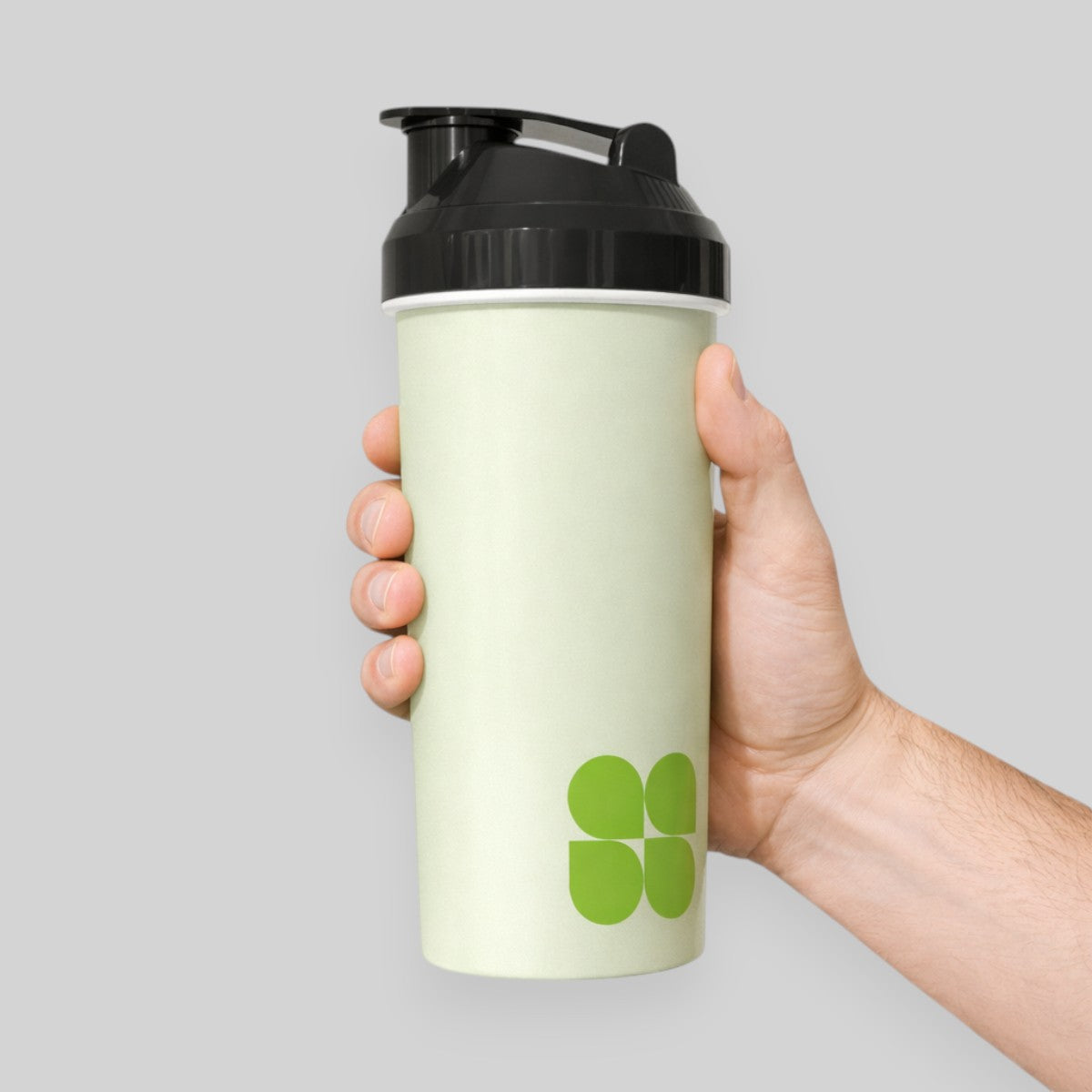 Stockka light green plastic protein shaker with black lid and green logo. 450ml capacity.