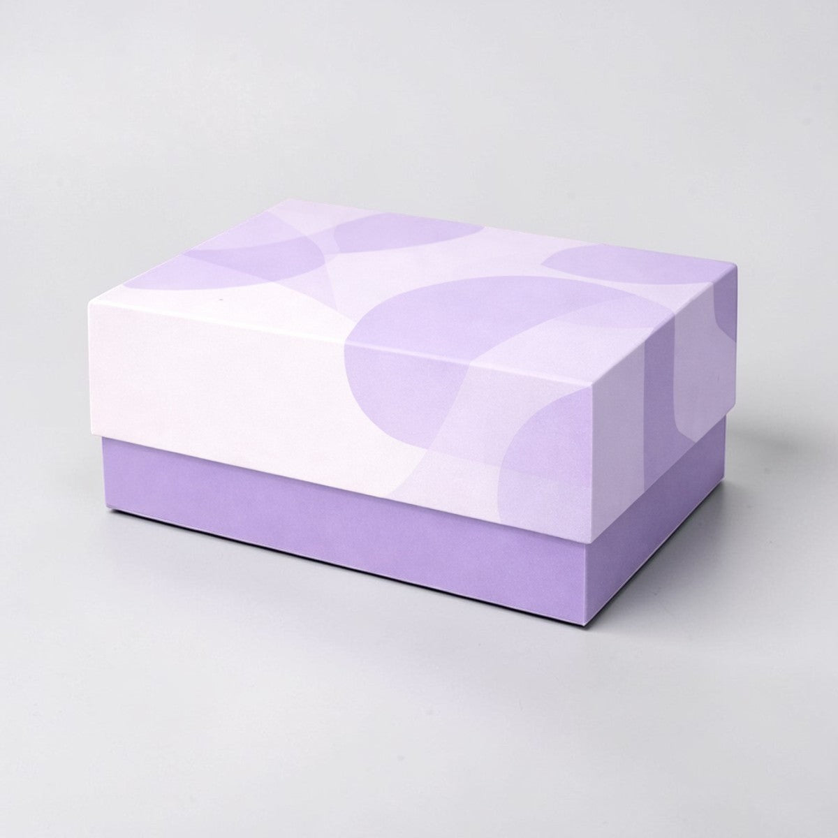 Stockka two-piece rigid cardboard gift box with separate lid and base in lilac and white with abstract pattern. Ideal for luxury packaging.
