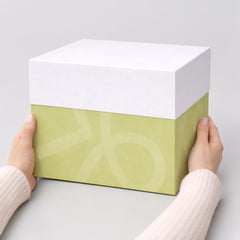 Stockka luxury gift box with removable lid, lime green with subtle pattern and white lid, premium rigid cardboard with matte finish.