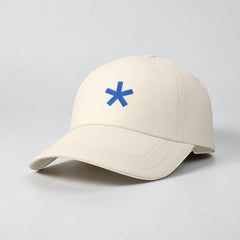 Stockka classic baseball cap in off-white cotton with a blue asterisk logo. Adjustable unisex fit.