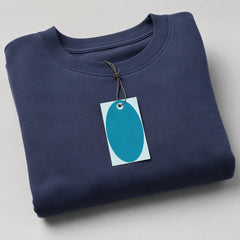Stockka navy blue oval hang tag on folded sweatshirt. Features reinforced hole for string.