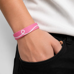 Stockka pink silicone bracelet with white ribbon design, flexible and durable for events or daily wear.